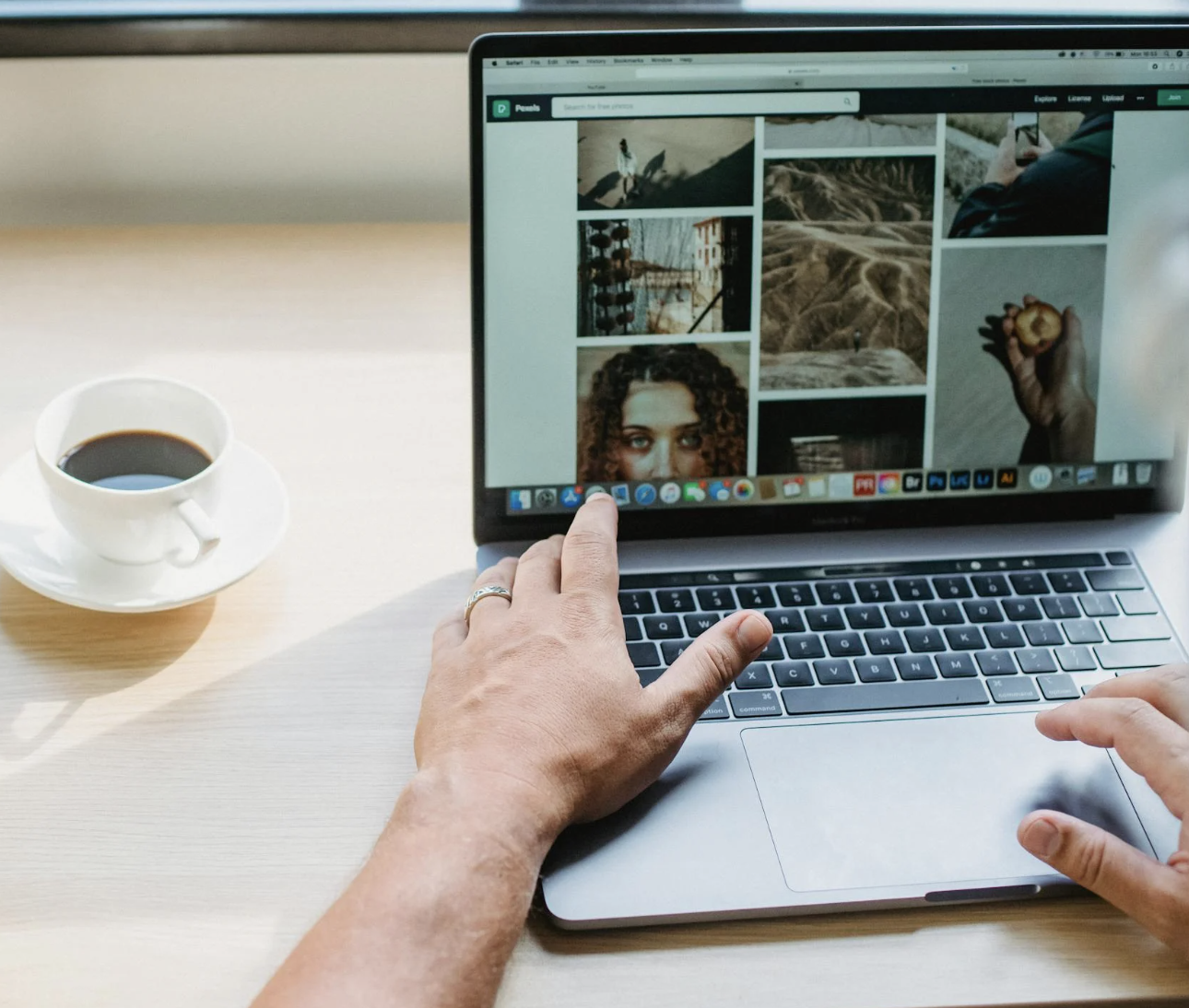 A designer working by hand on real brand visuals instead of AI-generated graphics